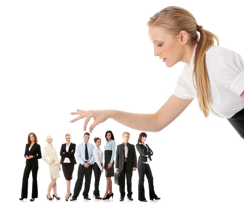 Businesswoman selecting individual from a group