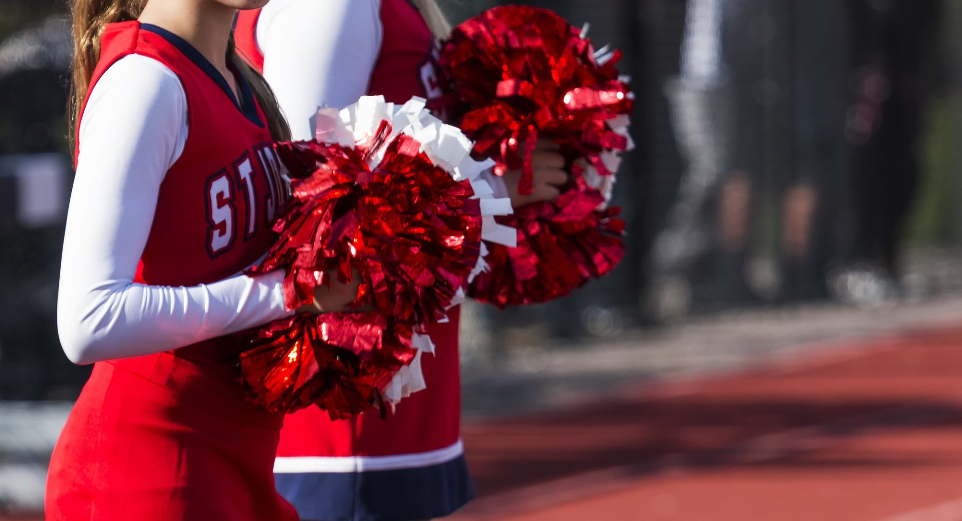 Cheerleaders motivating a team