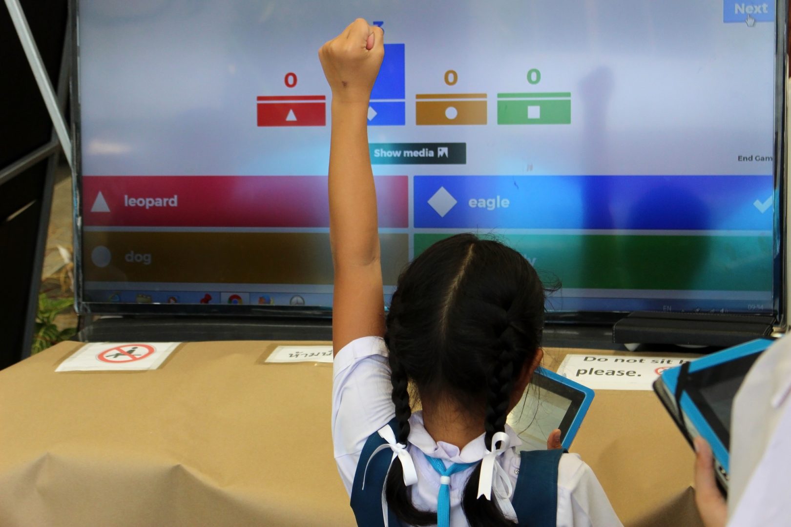 Kid playing a game on a computer